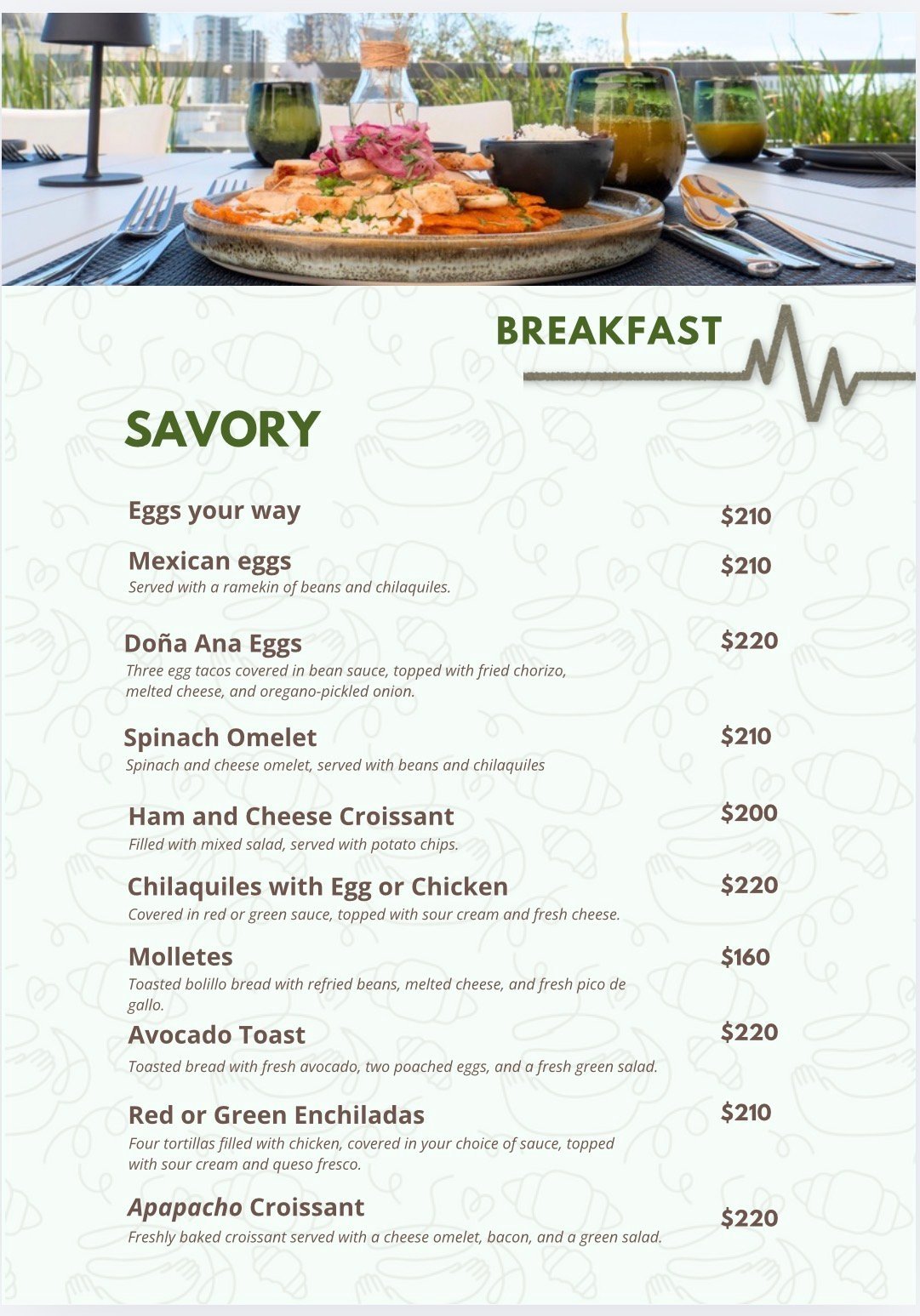 Breakfast menu with savory dishes and prices, featuring a photo of a plated meal with fresh ingredients and beverages on a rooftop setting